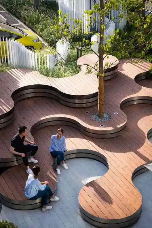 A modern outdoor space with people sitting